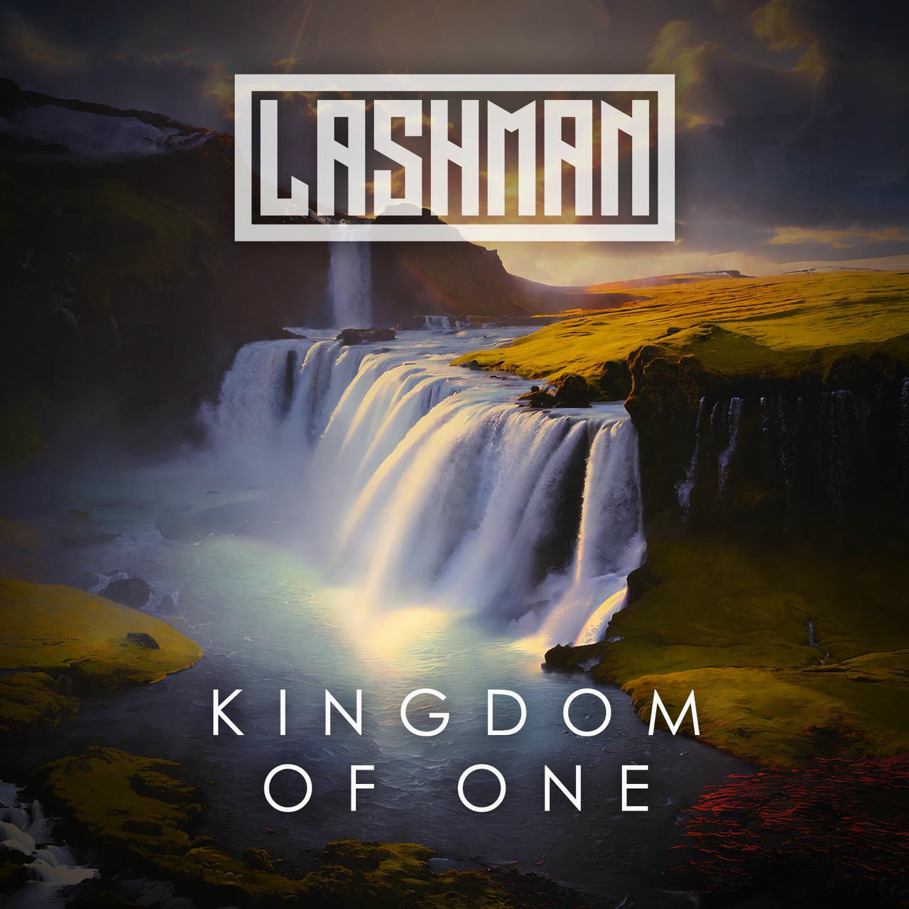A dramatic, wide-angle photograph captures a powerful waterfall cascading down a rocky cliff face into a misty pool. The water is a brilliant white, illuminated by sunlight, creating a dynamic spray. Behind the waterfall, a rugged, golden-hued landscape of rolling hills and distant mountains stretches into the horizon. The sky is a pale, hazy gray. The words "KINGDOM OF ONE" are prominently displayed in white across the top of the image.